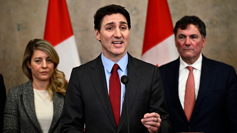 Canadian Prime Minister Justin Trudeau addresses media members after U.S. President Donald Trump signed an order to impose stiff tariffs on imports from Mexico, Canada and China, in Ottawa, Canada, Saturday, Feb. 1, 2025. (Justin Tang/The Canadian Press via AP)