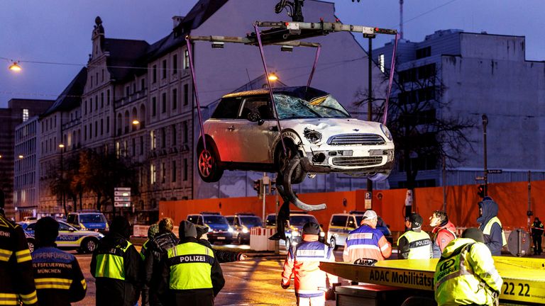 The car is lifted onto a tow truck.
Pic: AP