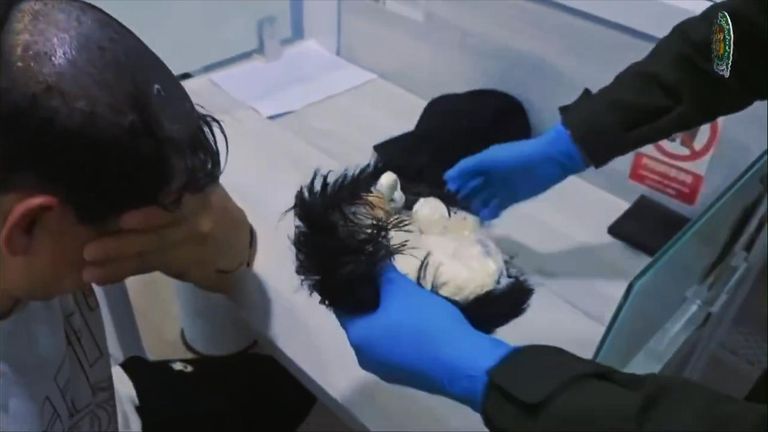 Man caught trying to smuggle cocaine under a wig in Colombia | World News |  Sky News