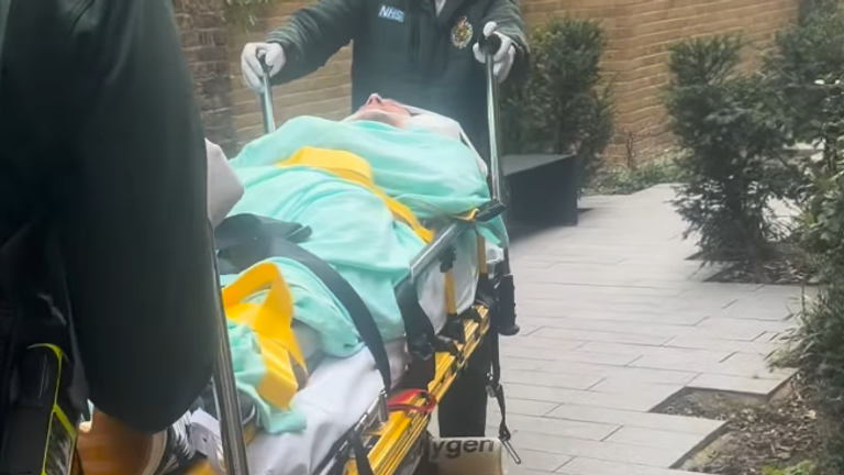 Maynard being wheeled out on a stretcher.
Pic: @ConorMaynard/Instagram