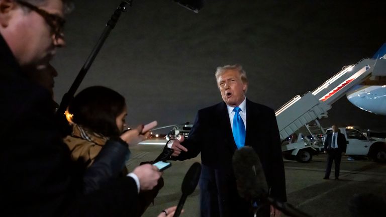 Donald Trump speaks to reporters next to Air Force One after arriving back at Joint Base Andrews. Pic: AP Photo/Ben Curtis