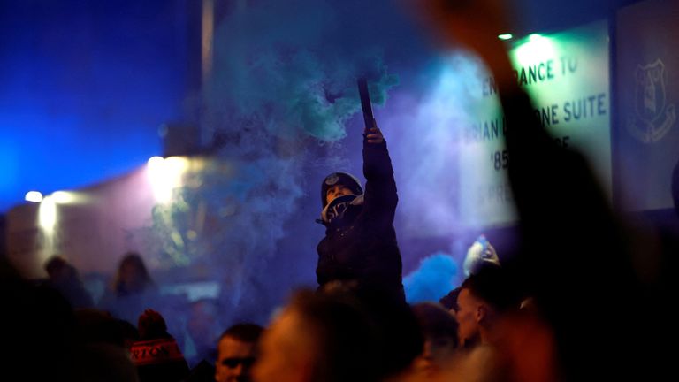 Everton fans with flares outside the stadium before the match. Pic: Reuters