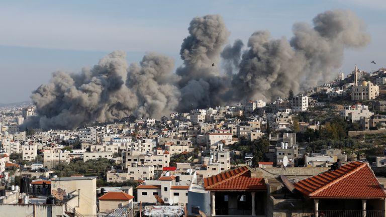 Smoke rises over Jenin after the Israeli explosions.
Pic: Reuters/Mohammed Torokman