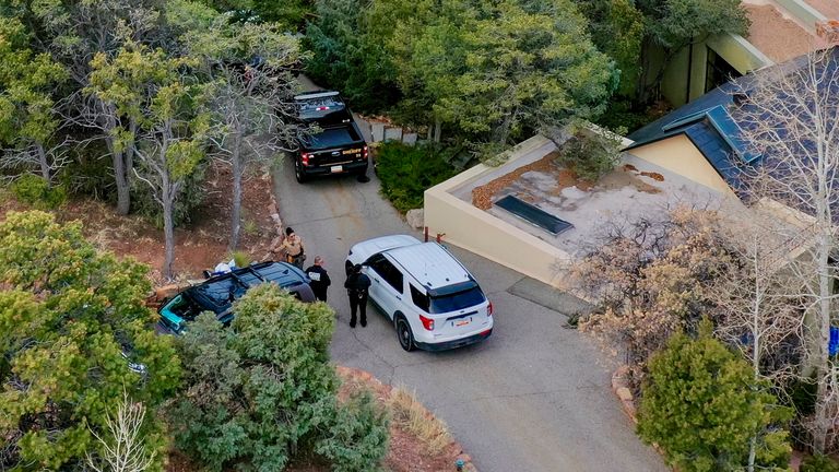 Santa Fe County deputies remain outside the house belonging to actor Gene Hackman and his wife Betsy Arakawa were earlier found dead, Thursday, Feb. 27, 2025 in Santa Fe, N.M. (AP Photo/Roberto E. Rosales)