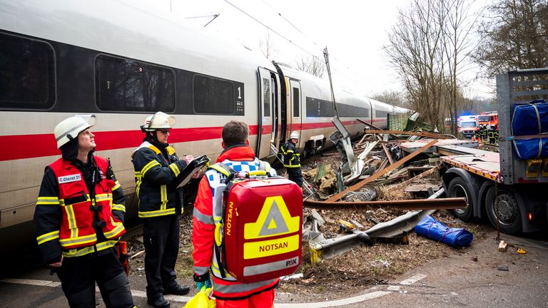 11 February 2025, Hamburg: Emergency services stand at the scene of an accident at a level crossing. One person has been killed and several injured in a collision between an ICE train and a truck. Photo by: Daniel Bockwoldt/picture-alliance/dpa/AP Images