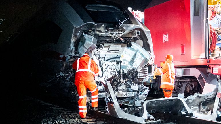 dpatop - 12 February 2025, Hamburg: Railroad technicians work on a damaged ICE after a train accident. One person was killed and several injured when an ICE train collided with a truck. Photo by: Daniel Bockwoldt/picture-alliance/dpa/AP Images