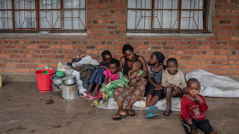 Zawadi Sifa, 35, who has been fleeing fighting from camp to camp, sits with her seven children at her latest displaced camp in Goma, Democratic Republic of the Congo, Thursday, Feb. 5, 2025.(AP Photo/Moses Sawasawa)