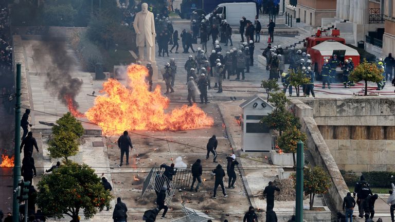 People clash with police near the Greek parliament at a protest marking the second anniversary of the country's worst railway disaster, while an investigation continues, in Athens, Greece, February 28, 2025. REUTERS/Louiza Vradi