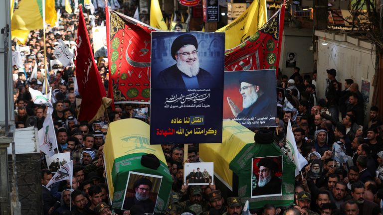 People attend a symbolic funeral for former Hezbollah leader Hassan Nasrallah and Hashem Safieddine, who were killed in Israeli airstrikes last year in Beirut, in Najaf, Iraq, February 23, 2025. REUTERS/Alaa Al-Marjani