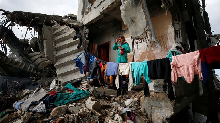 A Palestinian girl stands at the remains of her family&#39;s destroyed house where she takes shelter  in Jabalia refugee camp in the northern Gaza Strip.
Pic: Reuters