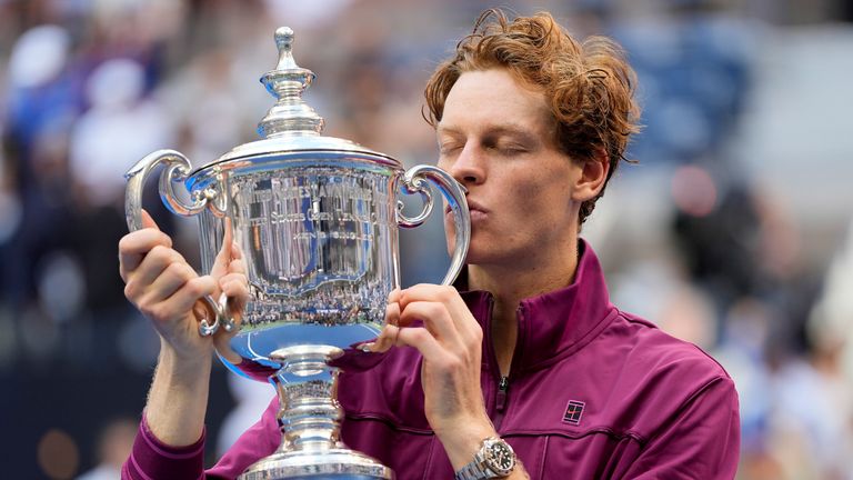 Jannik Sinner, of Italy, kisses the championship trophy after defeating Taylor Fritz, of the United States, in the men's singles final of the U.S. Open tennis championships, Sunday, Sept. 8, 2024, in New York. (AP Photo/Julia Nikhinson)