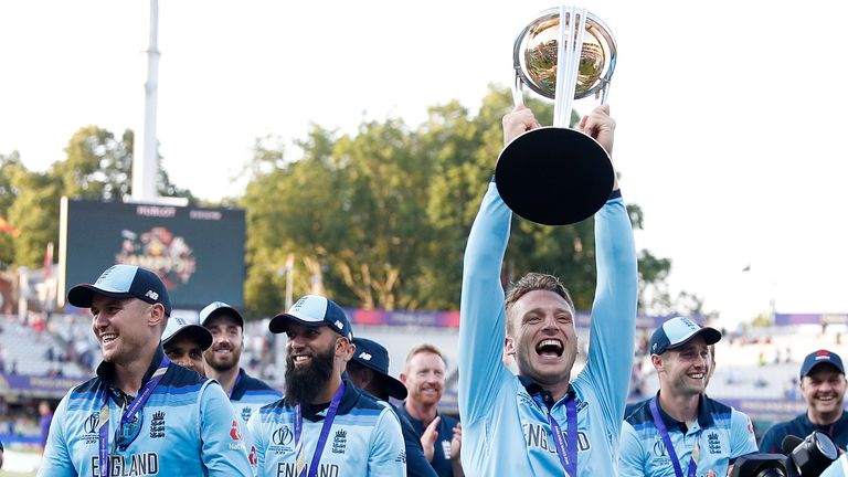 England Jos Buttler holds the trophy as he celebrates after winning the Cricket World Cup final match between England and New Zealand at Lord's cricket ground in London, Sunday, July 14, 2019. England won after a super over after the scores ended tied after 50 overs each. (AP Photo/Alastair Grant)


