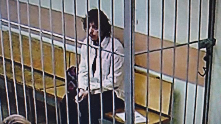 Kalob Wayne Byers, detained on suspicion of drug smuggling, appears on a screen in a courthouse in Moscow. Pic: Reuters/Moscow City Court's Press Office