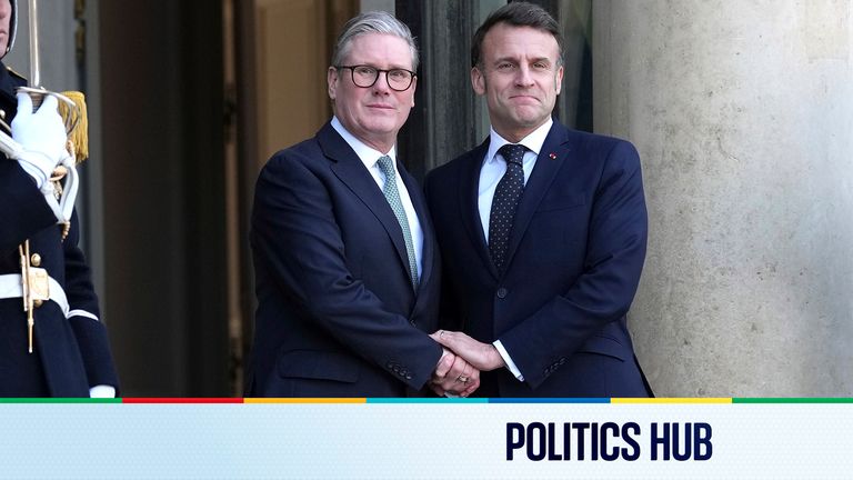 Emmanuel Macron shakes hands with Keir Starmer.
Pic: AP