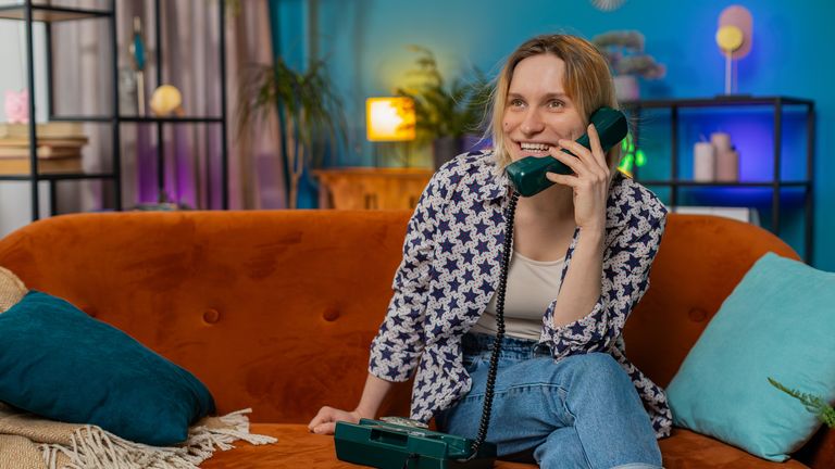 A woman on a landline phone