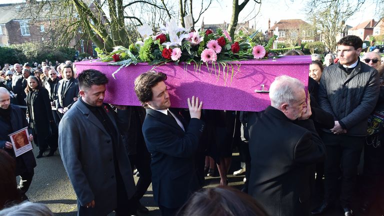 Nolan's sons Shane Jr (left) and (Jake) help carry her coffin. Pic: PA