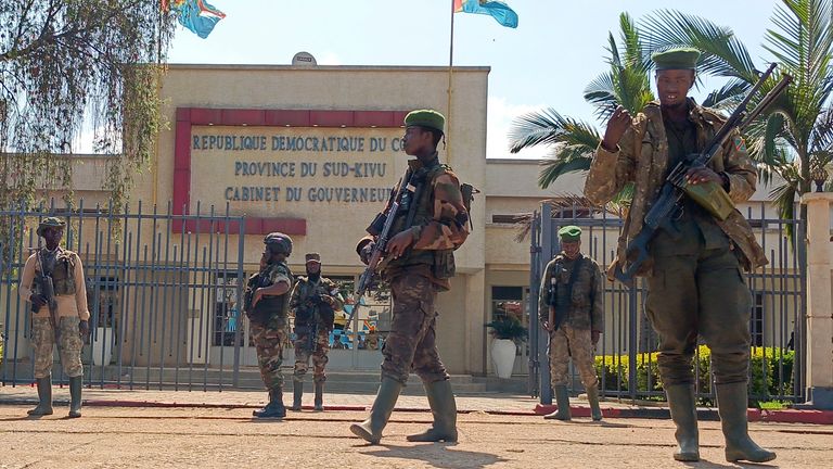 M23 rebels guard outside the South Kivu province administrative office in Bukavu. Pic: AP