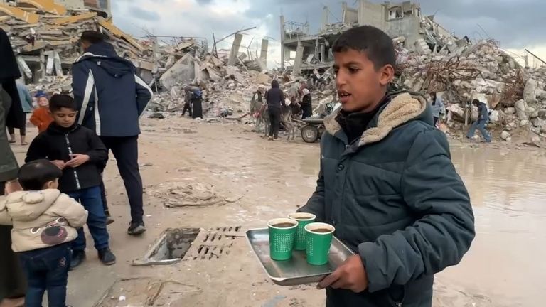 Boy serving coffee in Gaza street