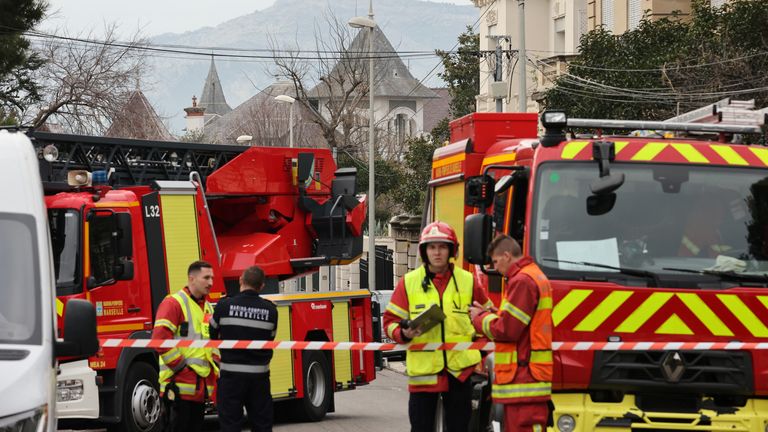 Firefighters near the entrance of the Russian consulate in Marseille. Pic: Reuters