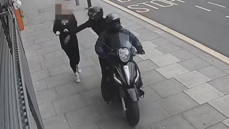 The moment a duo on a moped tried to snatch a phone from a woman's hand.
Pic: Met Police