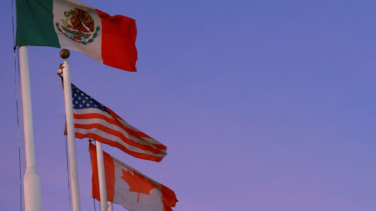 The flags of Mexico, the United States and Canada. Pic: Reuters