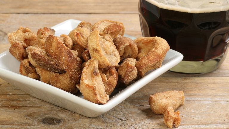 Pork scratchings are still a popular choice. Pic: iStock