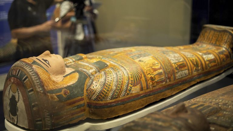 A mummy in an unopened sarcophagi. Pic: AP