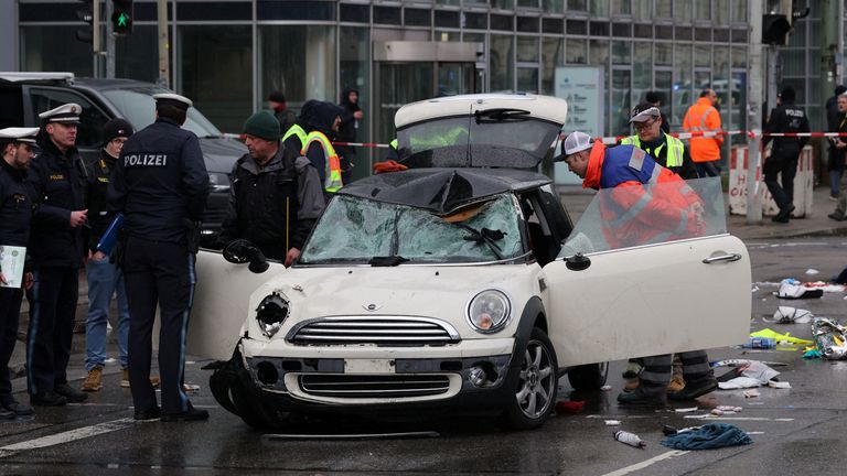 Police work at a car which drove into a crowd in Munich, Germany, February 13, 2025, injuring several people. REUTERS/Wolfgang Rattay