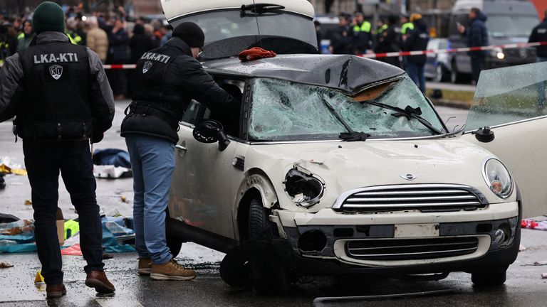 Police work at a car which drove into a crowd in Munich, Germany, February 13, 2025, injuring several people. REUTERS/Wolfgang Rattay