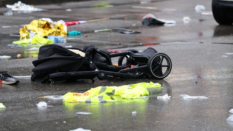 A pram lies on the road beside a car that drove into a crowd in Munich, Germany, February 13, 2025, injuring several people. REUTERS/Wolfgang Rattay