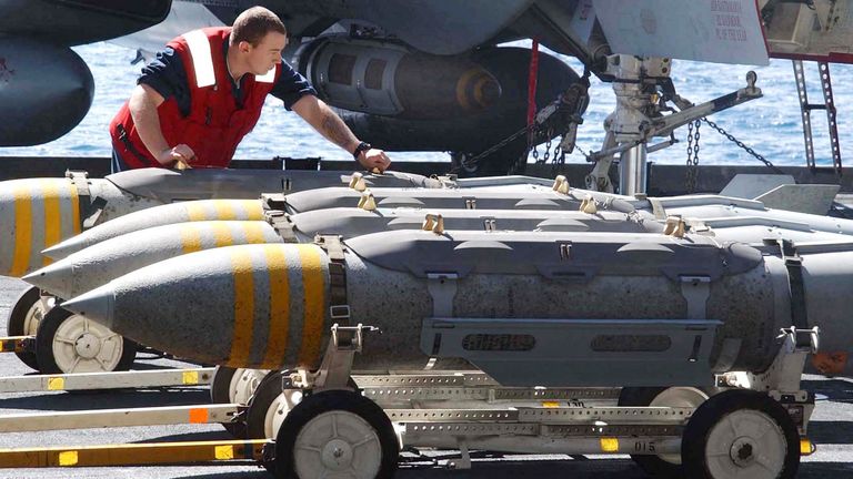 An aviation ordnance worker moves the heavy bombs.
File pic: Reuters/Jim Hampshire/US Navy photo/