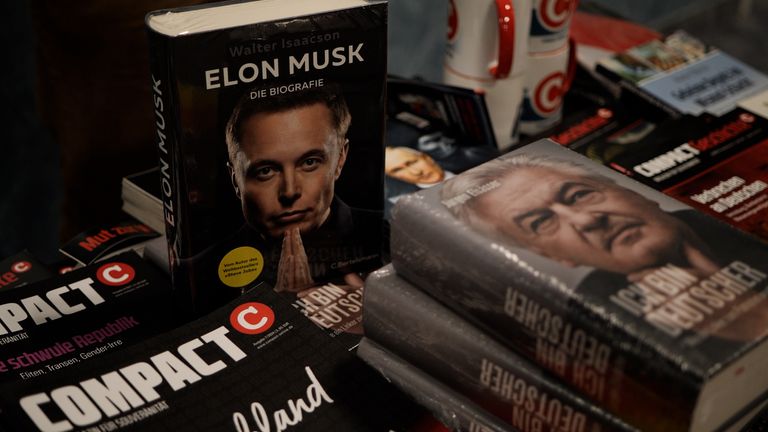 An Elon Musk biography stands on the merchandise table of an AfD rally