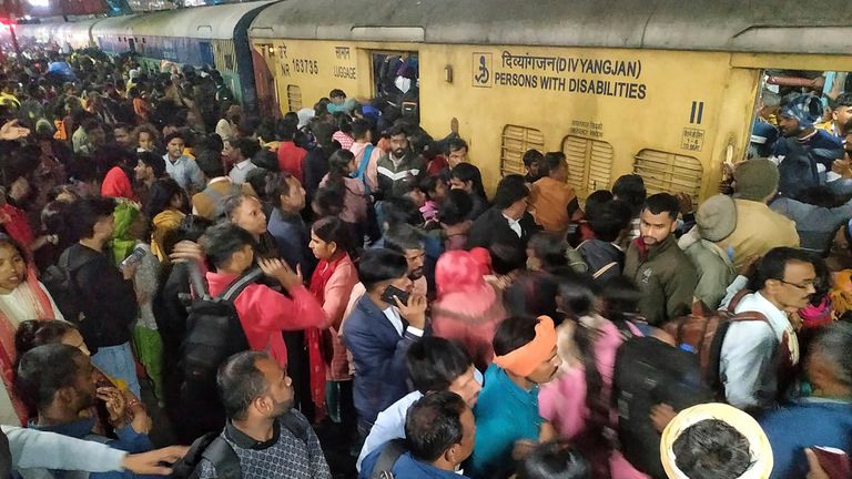 Passengers jostle with each other to board a train at the New Delhi Railway station, in New Delhi, India, Thursday, Feb.15, 2025. Pic: AP