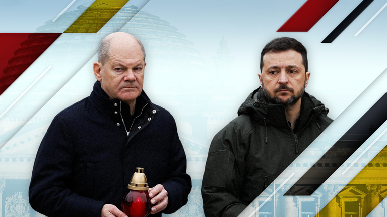 Ukraine's President Volodymyr Zelenskiy and German Chancellor Olaf Scholz walk to visit a makeshift memorial place displaying Ukrainian flags with the names of fallen service members, at the Independence Square, amid Russia's attack on Ukraine, in Kyiv, Ukraine December 2, 2024. REUTERS/Gleb Garanich