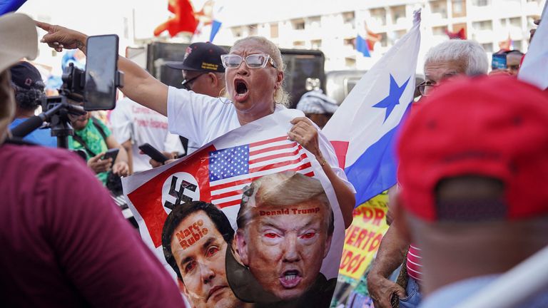 A woman gestures during a protest amid Mr Rubio's visit.
Pic: Reuters/Maria Fernanda Gonzalez