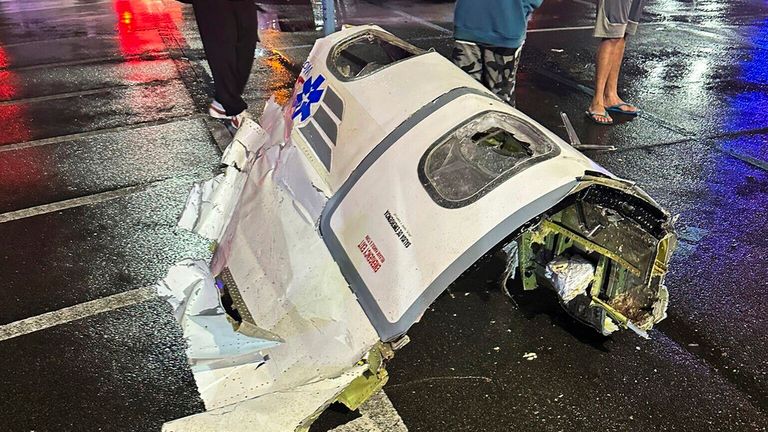 Debris from the small plane on the ground in Philadelphia. Pic: @Kikatechusa via AP