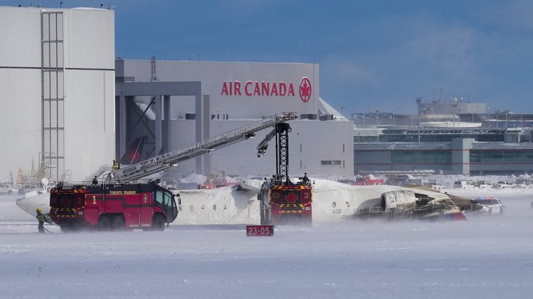 First responders work at the Delta Air Lines plane crash site at Toronto Pearson International Airport in Mississauga, Ontario, Canada February 17, 2025. REUTERS/Arlyn McAdorey