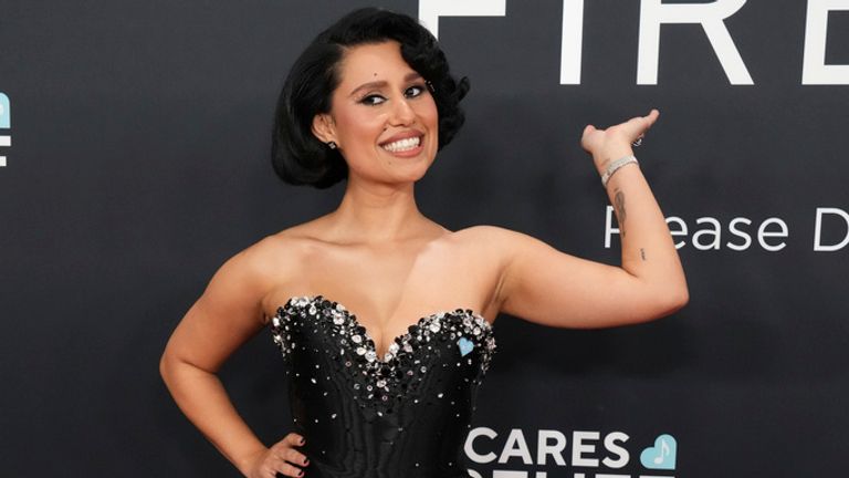 Flying the flag for the UK, Raye in a diamanté adorned black silk gown. Pic: AP