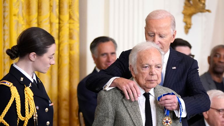 President Joe Biden, from right, presents the Presidential Medal of Freedom, the Nation's highest civilian honor, to fashion designer Ralph Lauren in the East Room of the White House, Saturday, Jan. 4, 2025, in Washington. (AP Photo/Manuel Balce Ceneta)