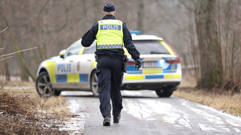 A police officer at Risbergska School in Orebro, Sweden.
Pic: TT News Agency/Kicki Nilsson/Reuters