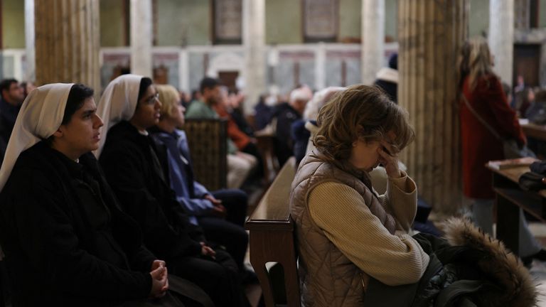 Argentine community members gather to pray for Pope Francis, at Santa Maria Addolorata, as Pope Francis continues his treatment at Gemelli Hospital, in Rome, Italy, February 25, 2025. REUTERS/Hannah McKay