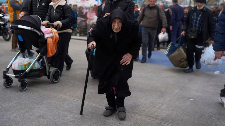 Flora, 94, said she survived a deadly earthquake on Santorini in 1956, as she boards a ferry bound for the Greek mainland, in the earthquake-struck Greek island, Tuesday, Feb. 4, 2025. (AP Photo/Petros Giannakouris)