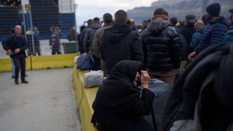 Flora, 94, said she survived a deadly earthquake on Santorini in 1956, as she boards a ferry bound for the Greek mainland, in the earthquake-struck Greek island, Tuesday, Feb. 4, 2025. (AP Photo/Petros Giannakouris)