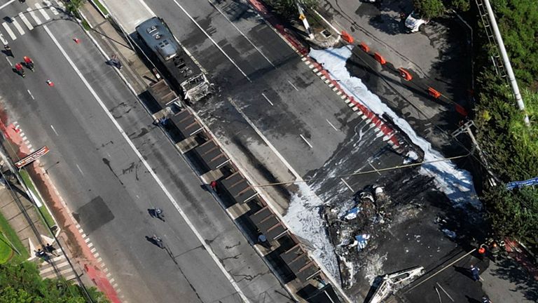 A drone view of the site where a small plane crashed into vehicles on Marques de Sao Vicente Avenue in Sao Paulo.
Pic: Reuters