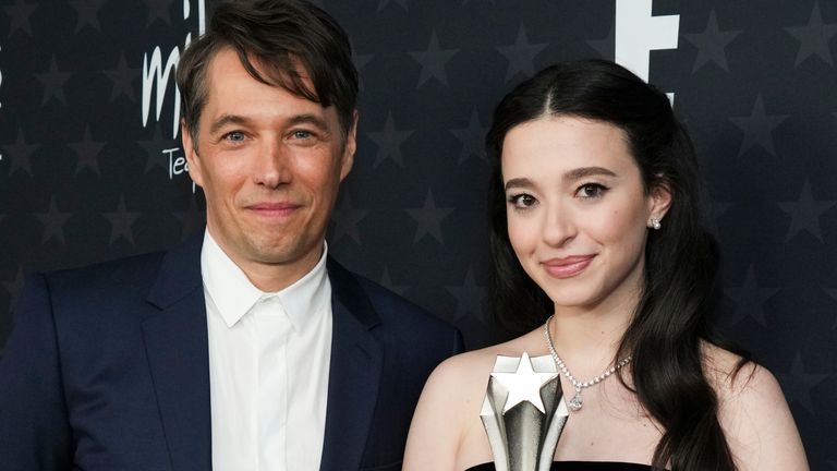 Anora filmmaker Sean Baker, left, and star Mikey Madison with their award for best picture at the Critics Choice Awards 2025. Pic: Jordan Strauss/Invision/AP