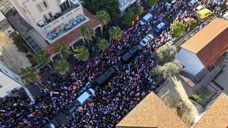 A drone view shows Israelis gathering on the day of a funeral procession for Shiri, 32, and her two children, Kfir, 9 months old, and Ariel, 4, of the Bibas family, who were kidnapped from their home in Kibbutz Nir Oz, during the deadly October 7, 2023 attack by Hamas and then killed in Gaza, in Rishon Le'Zion, Israel February 26, 2025. REUTERS/Ilan Rosenberg TPX IMAGES OF THE DAY