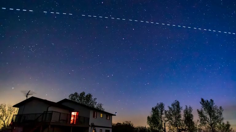 Starlink satellites pass above a house in California. File pic: AP/Alan Dyer