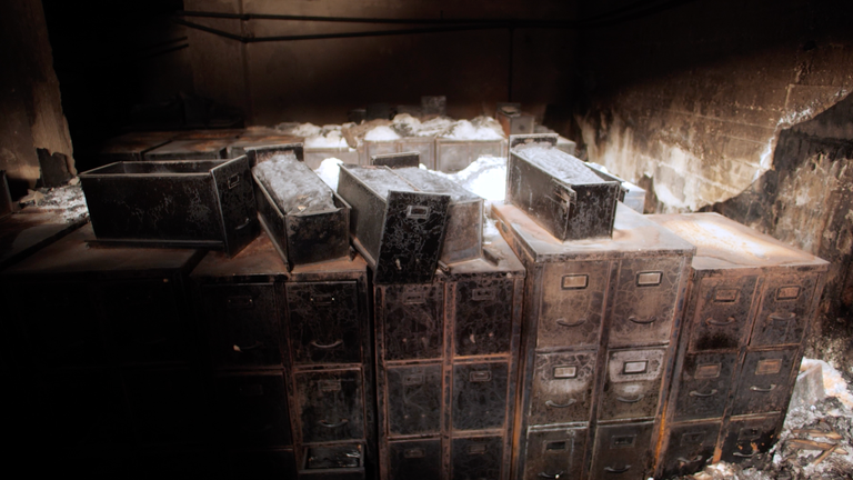 BURNT METAL DRAWERS WITH DOCUMENTS