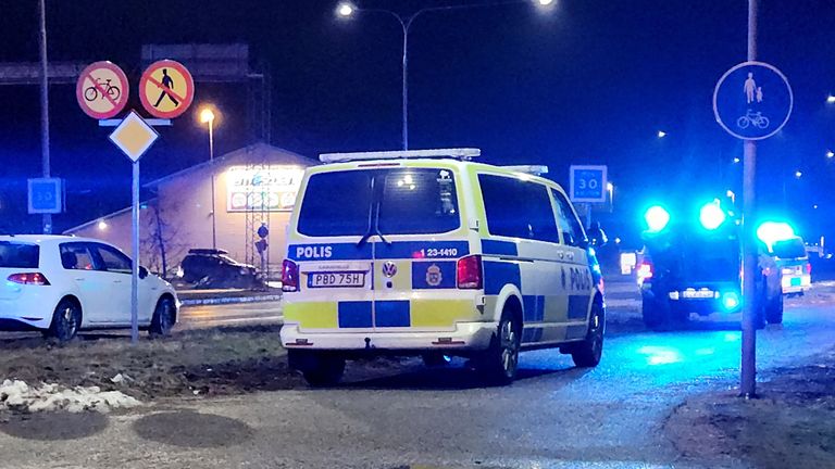 Police cars pass near the adult education center Campus Risbergska school after a shooting attack in Orebro, Sweden, February 4, 2025. REUTERS/Philip O'Connor