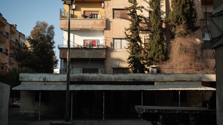 TAHA TADMORI BALCONY OVERLOOKS PRISON